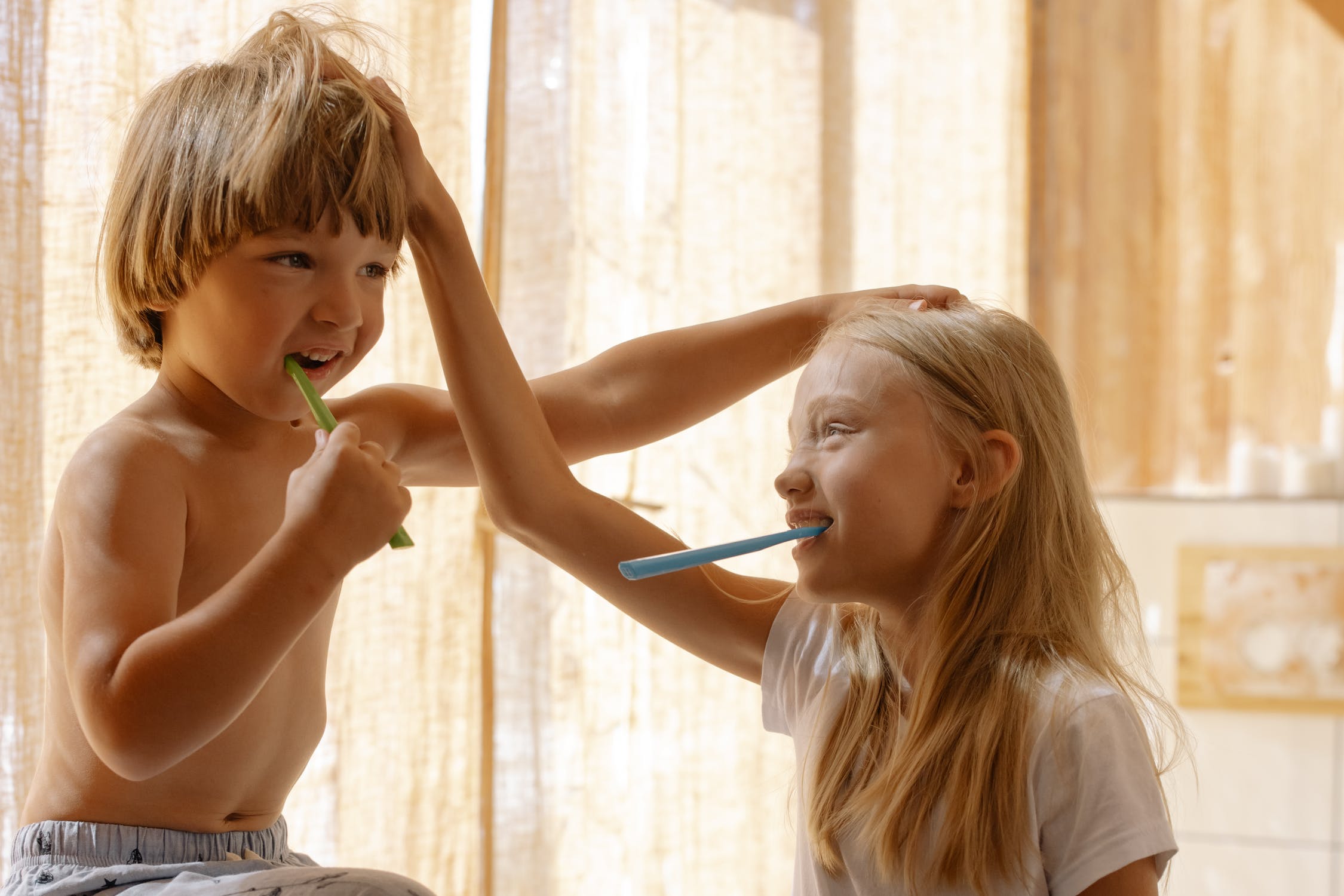 Children brushing teeth